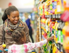 Female shopper and daughter in supermarket